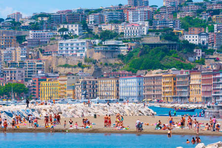 Naples, Italy - may 27: Summer day on the Mediterranean coast. People relax, sunbathe and swim on Mappatella Beach on Quay of Via Francesco Caracciolo. May 27, 2012. Naples, Campania, Italy.のeditorial素材