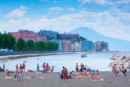 Naples, Italy - may 27: Summer day on the Mediterranean coast. People relax, sunbathe and swim on Mappatella Beach on Quay of Via Francesco Caracciolo. May 27, 2012. Naples, Campania, Italy.のeditorial素材