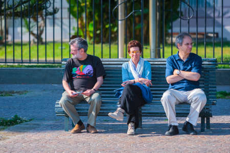 Naples, Italy - may 27: Summer day on the Mediterranean coast. People relax walking, sunbathe and enjoy life at the seafront. Retirees are sitting on a bench. May 27, 2012. Naples, Campania, Italy.のeditorial素材