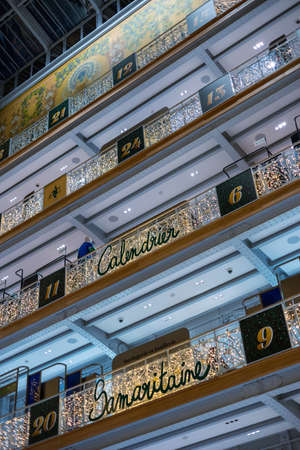 Paris, France - DEC 04, 2021: People shopping in the luxury mall "La Samaritaine" department store. Inside the building Christmas atmosphere and decorations in Paris France, December 04, 2021のeditorial素材