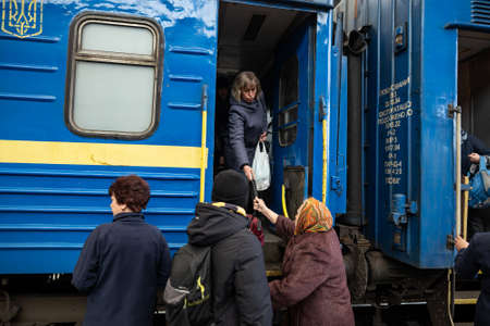 LVIV, UKRAINE - APR 02, 2022: War in Ukraine. Refugees women, children, elderly from the evacuation...