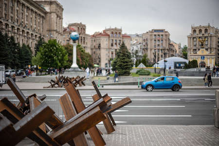 KYIV, UKRAINE - MAY 20, 2022: Anti-tank hedgehogs or Czech hedgehogs on the side of the road are ready to block Independence Square in the event of an attack by enemy Russian troops.のeditorial素材