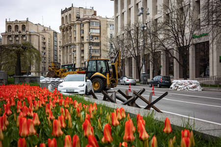 KYIV, UKRAINE - APR 20, 2022: Anti-tank hedgehogs or Czech hedgehogs on the side of the road are...