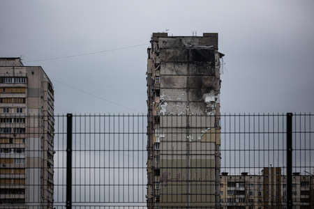 KYIV, UKRAINE - APR 21, 2022: The rooftop and apartments of an apartment building on Poznyaky was...