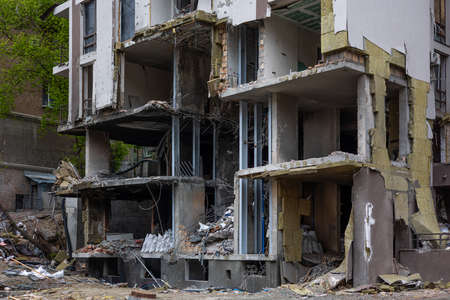 KYIV, UKRAINE - MAY 22, 2022: The facade a lower floorsof an apartment building on Tatarka was destroyed by the Kalibr cruise missile on the second day of the full-scale Russian invasion of Ukraine.のeditorial素材