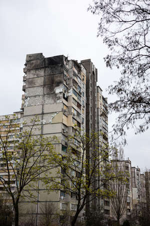KYIV, UKRAINE - APR 21, 2022: The rooftop and apartments of an apartment building on Poznyaky was...