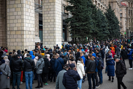 KYIV, UKRAINE - APR 20, 2022: A crowd of people standing in line at the Head Post Office for a stamp...