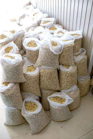 sorting and packing line of stuffed breakfast cereal pillows at factory conveyor for cereal snack...