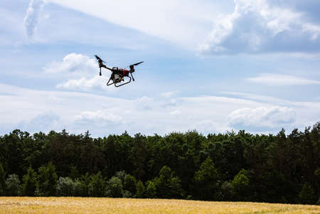 A modern solution in agricultural. Use of robotic systems with agriculture spraying drone fly to...