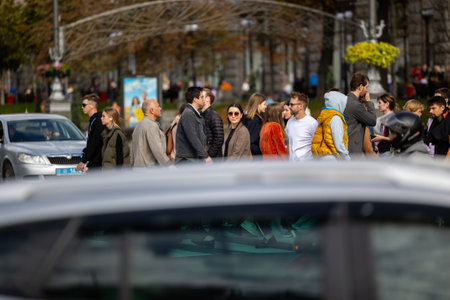 Kyiv, Ukraine - OCT 01, 2022: People, residents and guests, at warm autumn weekend on the streets of the capital stroll in the historical center and go shopping. A everyday street life in a big city.のeditorial素材