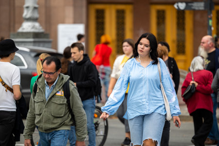 Kyiv, Ukraine - OCT 01, 2022: People, residents and guests, at warm autumn weekend on the streets of the capital stroll in the historical center and go shopping. A everyday street life in a big city.のeditorial素材