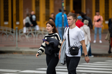 Kyiv, Ukraine - OCT 01, 2022: People, residents and guests, at warm autumn weekend on the streets of...