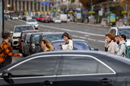 Kyiv, Ukraine - OCT 01, 2022: People, residents and guests, at warm autumn weekend on the streets of the capital stroll in the historical center and go shopping. A everyday street life in a big city.のeditorial素材