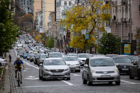 Kyiv, Ukraine - OCT 01, 2022: View on Velyka Vasylkivska street at warm autumn weekend. A picture of everyday cars traffic in the street a big city.のeditorial素材
