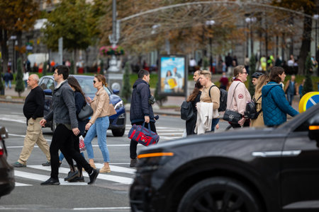 Kyiv, Ukraine - OCT 01, 2022: People, residents and guests, at warm autumn weekend on the streets of...