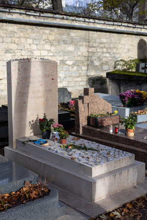 A grave of Jean-Paul Sartre and Simone de Beauvoir on Montparnasse Cemetery, Paris, France. A famous couple, was of the most influential and controversial writers and thinkers of the 20th centuryのeditorial素材