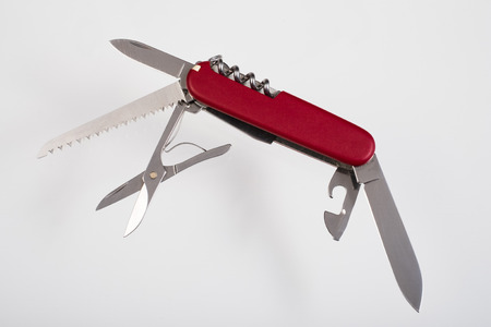 Red multitool open knife isolatedの写真素材