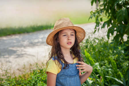 Beautiful Young Girl in a Straw Hatの写真素材
