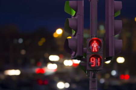 pedestrian traffic light red with countdown background night cityの写真素材