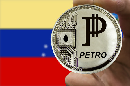 Coin Cryptocurrency Venezuela Petro on the background of the flag of Venezuela.の写真素材