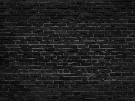 the dark grey black old brick wallの写真素材