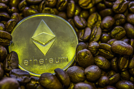 Silver coin cryptocurrency Ethereum is on the coffee beans. ETH.