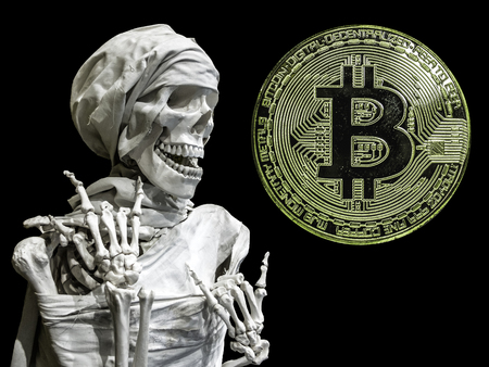 The skeleton model of the man and coin Bitcoin.の写真素材