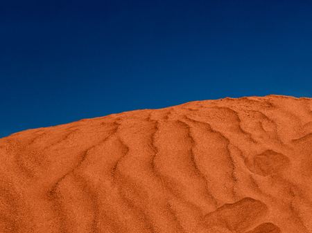 red sand hill in the desert and blue skyの写真素材