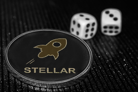 Coin cryptocurrency Stellar and rolling dice. XLM.の写真素材