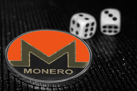 Coin cryptocurrency Monero and rolling dice. XMRの写真素材