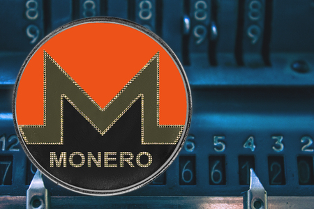 Coin cryptocurrency Monero and the numbers of the arithmometer. The concept of XMR.の写真素材