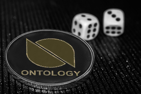 Coin cryptocurrency Ontology ONT and rolling dice.の写真素材