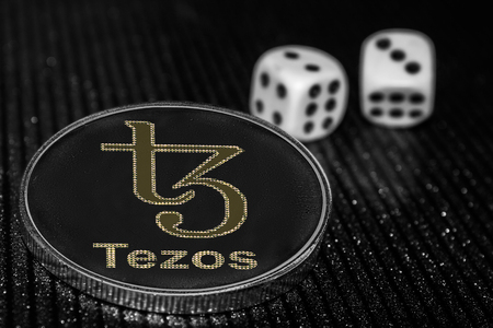 Coin cryptocurrency XTZ Tezos and rolling dice.の写真素材