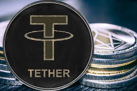 Coin cryptocurrency Tether on the background of a stack of coins. Token USDT.の写真素材