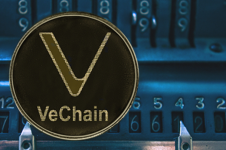 Coin cryptocurrency VET VeChain and the numbers of the arithmometer. The concept of XTZ.の写真素材