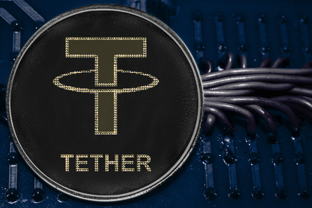 The coin cryptocurrency Tether on the background of wires and circuits. Crypto token USDT.の写真素材