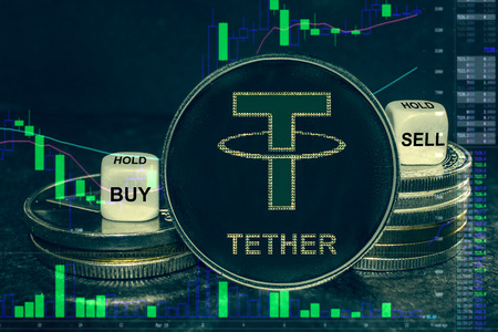 The coin cryptocurrency tether usdt stack of coins and dice. Exchange chart to buy, sell, hold.の写真素材