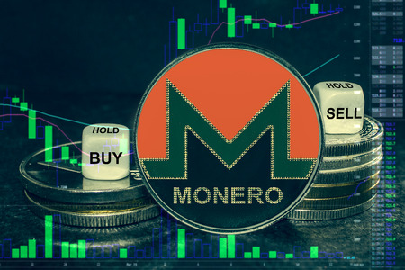 The coin cryptocurrency xmr monero stack of coins and dice. Exchange chart to buy, sell, hold.の写真素材
