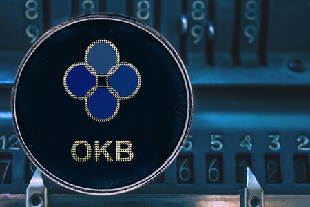 Coin cryptocurrency okb okex token and the numbers of the arithmometer.の写真素材