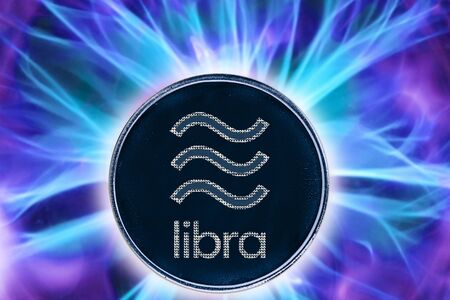 Birth or fork of libra cryptocurrency. Coin background real cold plasma.の写真素材
