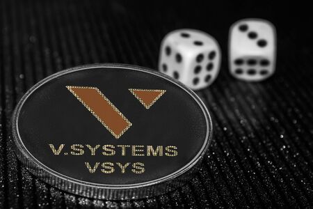 Coin cryptocurrency token VSYS vsystems and rolling dice.の写真素材