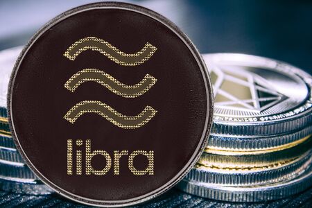 Coin cryptocurrency libra on the background of a stack of coins.の写真素材