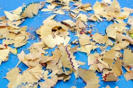 close-up on a colored background shavings after sharpening pencils