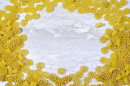 close-up wheel-shaped pasta. there is a place to add notesの写真素材