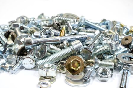 new metal bolts and nuts, washers in bulk close up