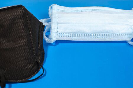 protective masks against coronovirus infection on a blue background
