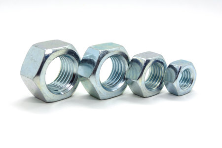 several metal nuts are installed in a row