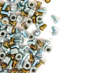 a group of small bolts and large metal nuts