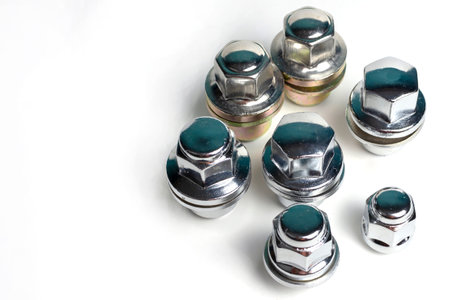 wheel nuts for the car plated with chrome on a white backgroundの写真素材