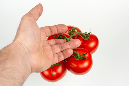a bunch of large tomatoes on a white backgroundの写真素材